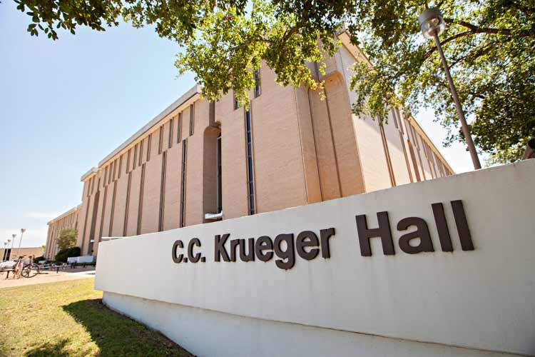 Exterior sign of Krueger Hall that has the full namesake of the dorm hall: C.C. Krueger Hall