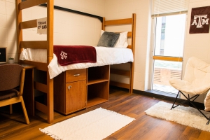Commons Hall dorm room lofted twin bed, with storage unit underneath.