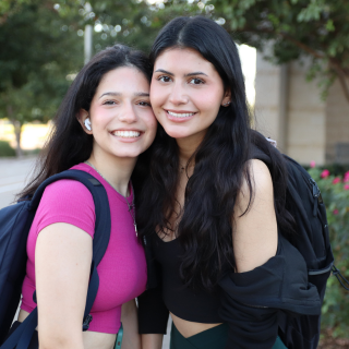 Two students smiling together