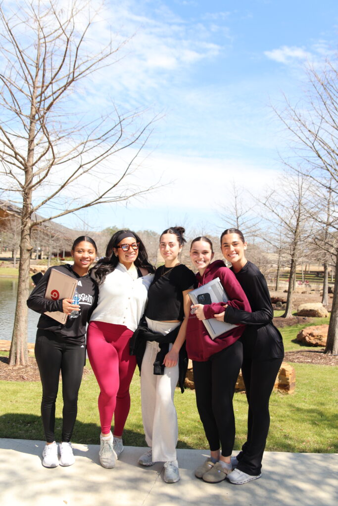 five female students in front of Aggiepark