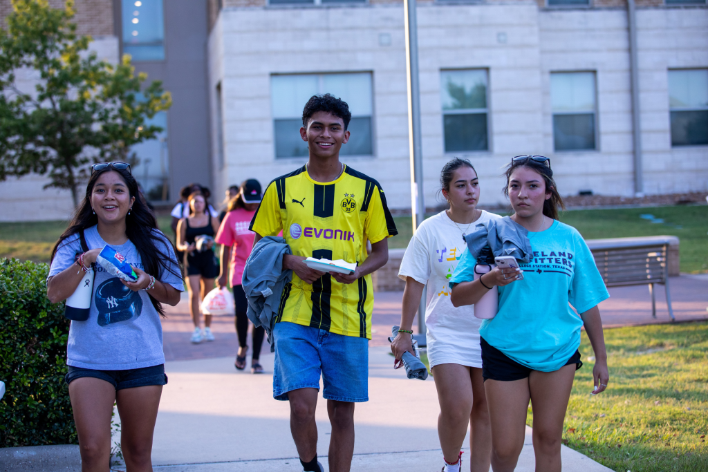 Students walking on campus in group