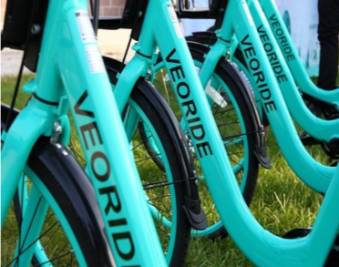 Image of several VeoRide bikes lined up in a row. Photo is courtesy of TAMU Transportation website.