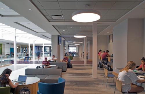 Students scattered throughout the interior study space in Hullabaloo Hall.