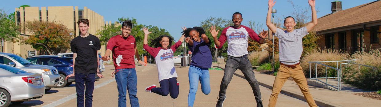 students jumping up together